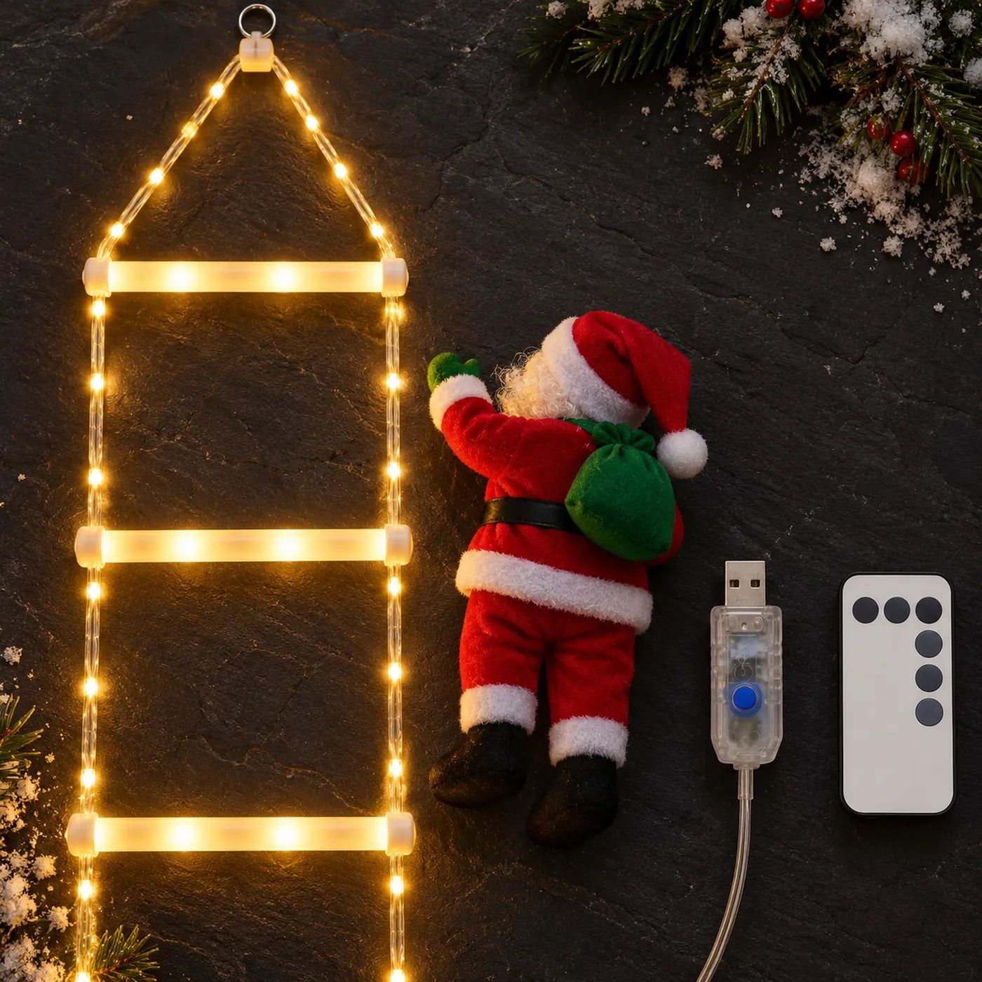 
What arrives: the ladder, the plush Santa, the USB controller with its lead and the remote, laid out on slate